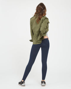 Model wearing Spanx - Jean-ish Ankle Leggings in twilight rinse back.