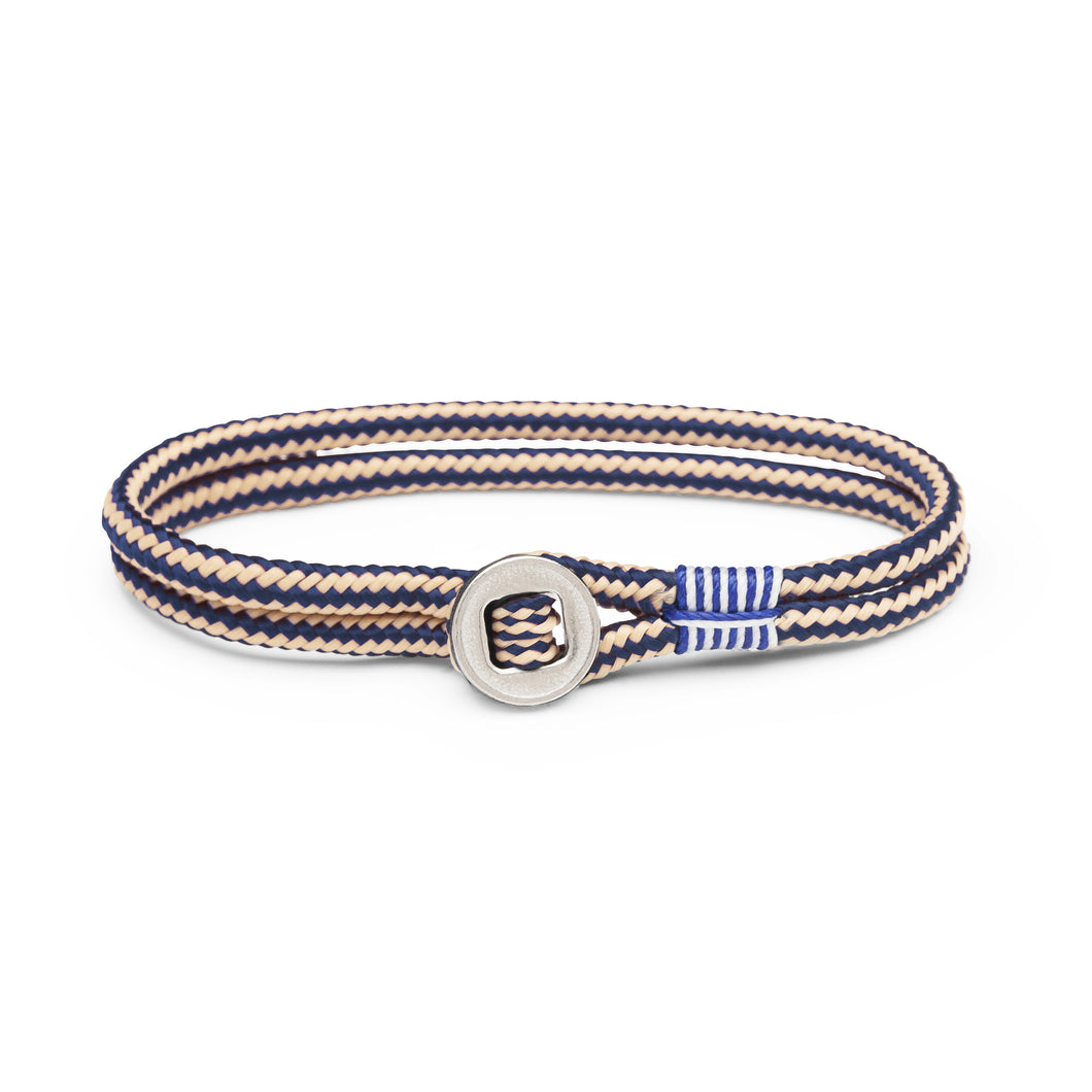 Pig & Hen Don Dino bracelet in navy / sand with silver ring.