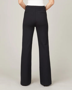Model wearing Spanx - The Perfect Pant, Hi-Rise Flare in Classic Black 20252R - back.