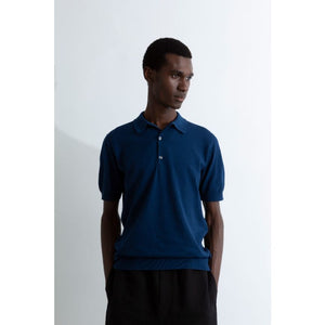 Model wearing John Smedley - Adrian S/S Polo Shirt in Indigo.