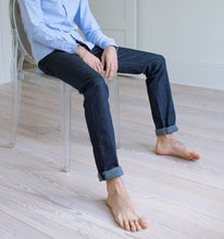 Load image into Gallery viewer, Model wearing Raleigh Denim Jones Resin Rinse jeans.
