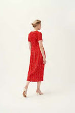 Load image into Gallery viewer, Model wearing Leo &amp; Ugo - Leaf Print Pleat Dress in Red/White.
