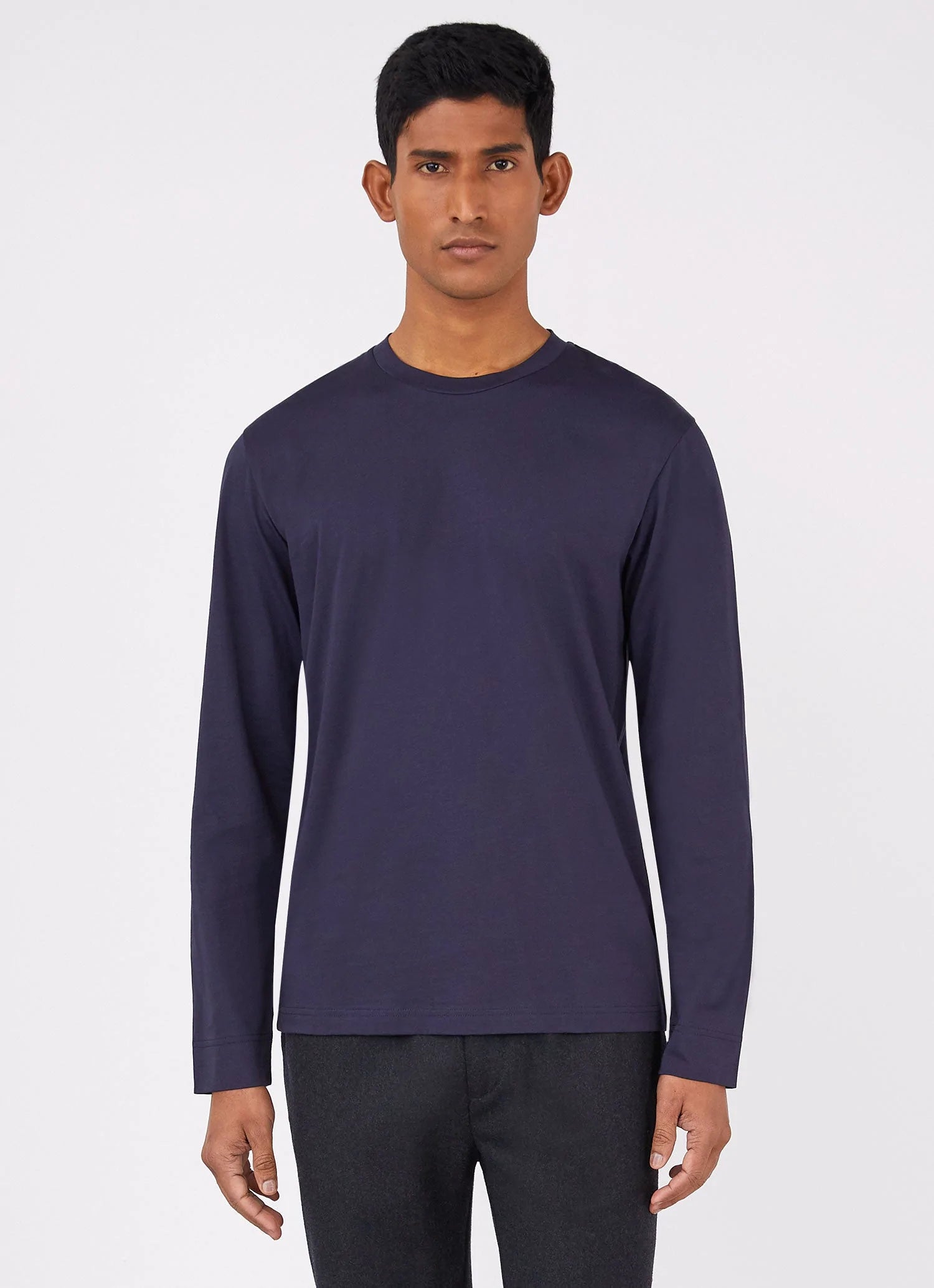 Model wearing Sunspel - Riviera LS Crew Neck Supima Cotton T-shirt in Navy.