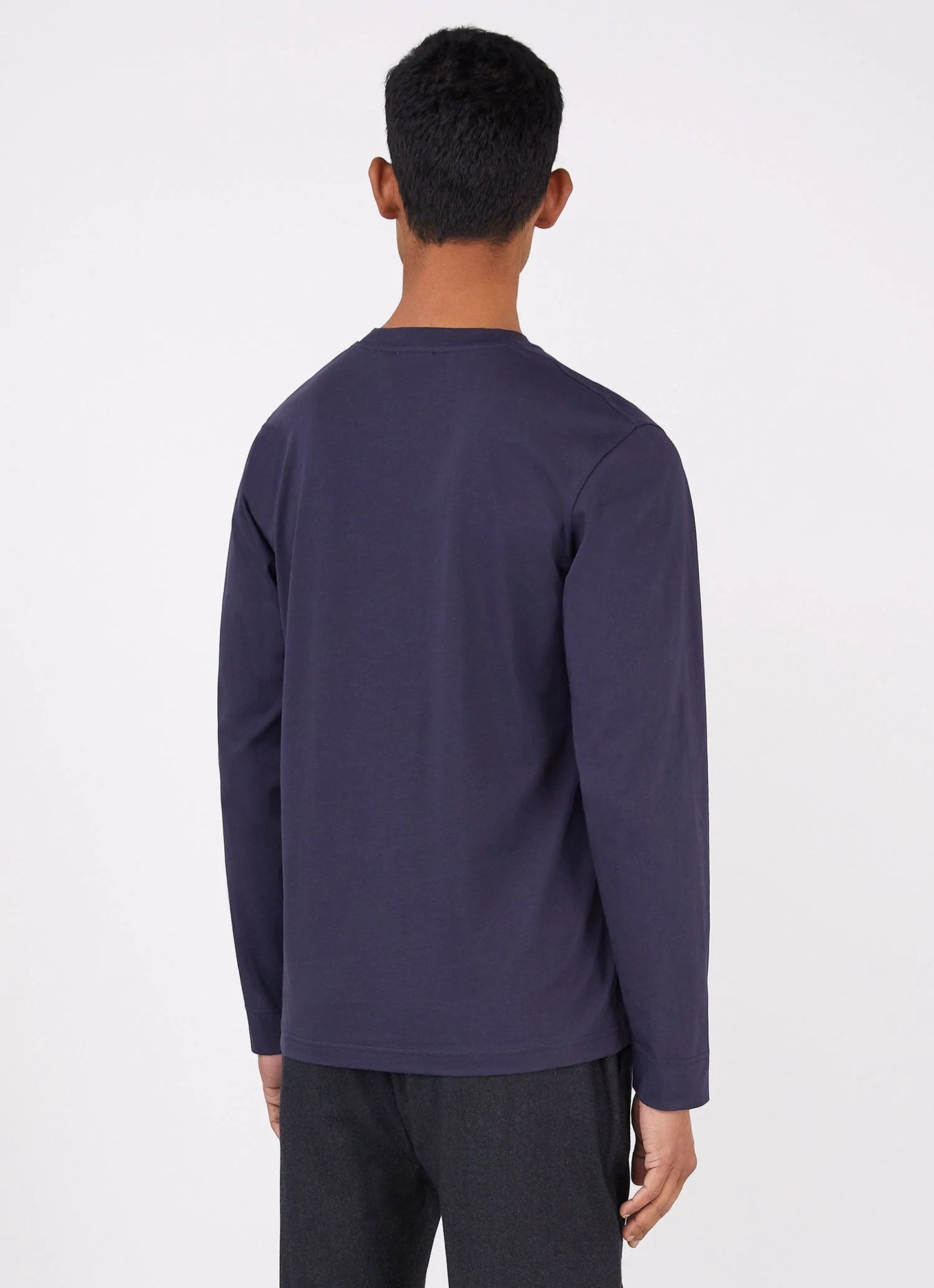 Model wearing Sunspel - Riviera LS Crew Neck Supima Cotton T-shirt in Navy - back.